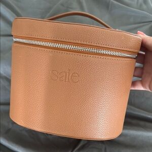 Saie Tan Cosmetic Case with Secure Zipper and Sturdy Design